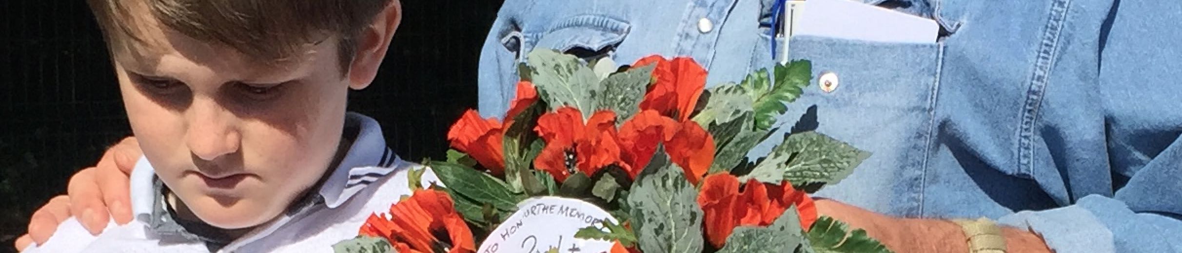 Jed and HEF place a wreath in the field where Eddie died in 1916